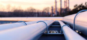 steel long pipe system in crude oil factory during sunset